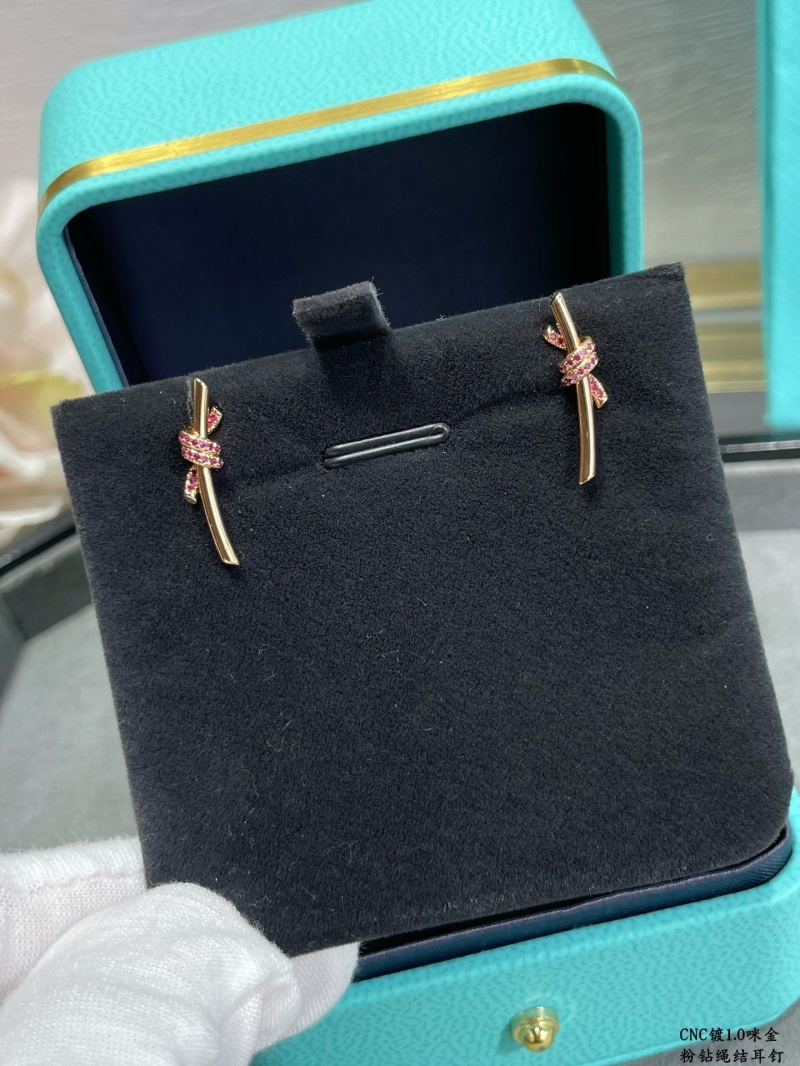 T*f*ny earrings